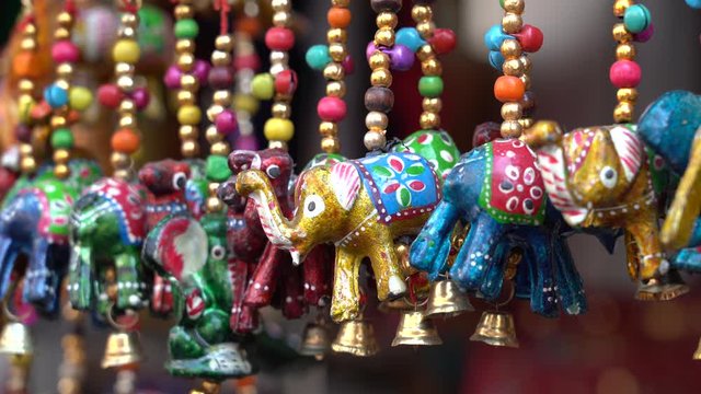 Colorful handmade souvenirs for sale in local street market in Udaipur, Rajasthan, India. Close up