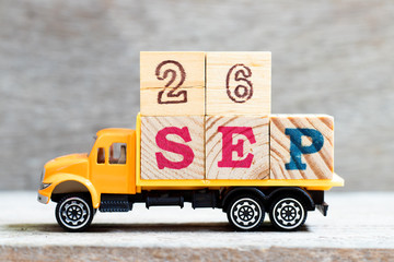 Truck hold letter block in word 26sep on wood background (Concept for date 26 month september)