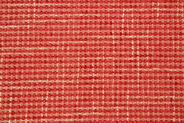 Boucle red fabric. The texture of the jacquard fabric