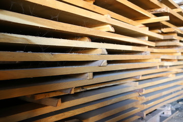 Wooden boards harvested for the furniture industry. With a shallow depth of field. Tree structure.