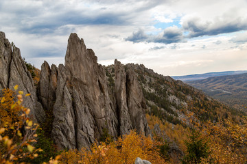 Mountain view at the beginning of golden autumn in clear weather