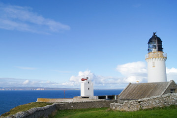 Fototapeta na wymiar The Dunnet head lighthouse at the most northerly point of the British mainland in Scotland