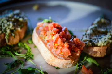mix bruschetta with fresh vegetables, goat cheese & grapes