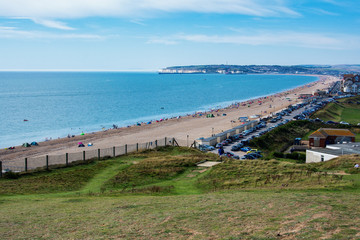 View of Seaford town from cliff tops, blue sea, Newhaven on the background, selective focus