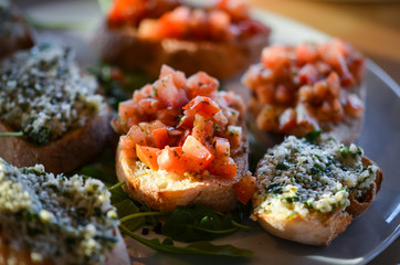 mix bruschetta with fresh vegetables, goat cheese & grapes