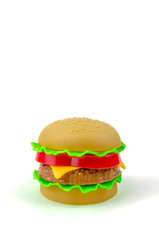 Fast food. A plastic hamburger. Isolated. White background