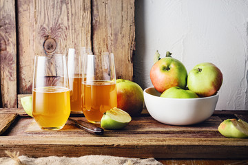 Glasses of fresh apple juice.