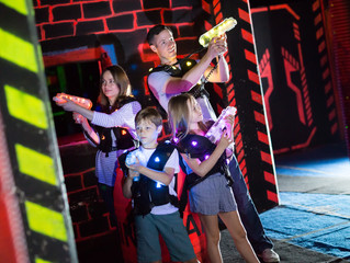 Kids with parents during lasertag game