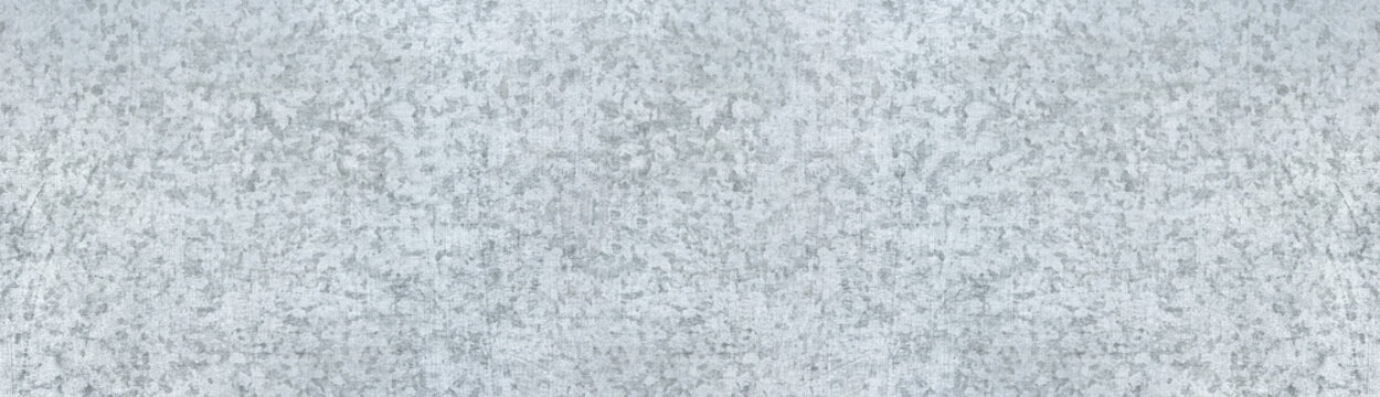 Old scratched steel metal wide texture. Silvery shabby panoramic metallic surface. Light gray widescreen background