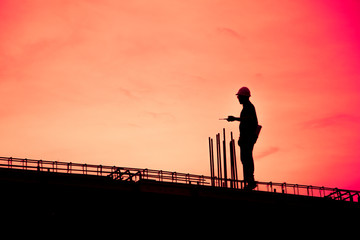 Construction worker using CB radio on a construction site,for construction teams to work in heavy industry
