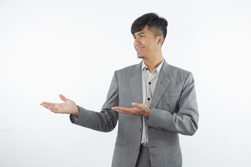 Business asian man showing something on the palm of his hand on white isolated background