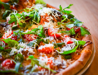 tasty italian pizza with fresh ingredients & vegetables