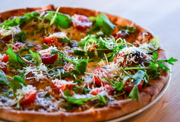 tasty italian pizza with fresh ingredients & vegetables