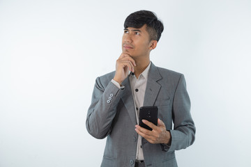 Young business asian man thinking of an idea isolated on white background.