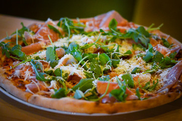 tasty italian pizza with fresh ingredients & vegetables