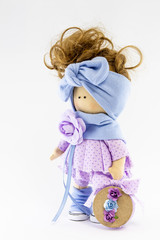 Handmade doll with natural hair. Isolated on a white background.