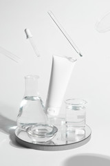 beauty spa medical skincare and cosmetic lotion bottle cream packaging product on white decor background and laboratory test glass tube in doctor healthy science concept