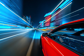 View from Side of Car moving in a night city