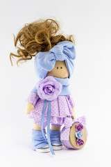 Handmade doll with natural hair. Isolated on a white background.
