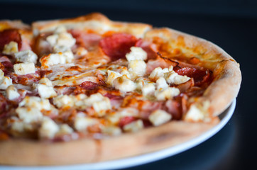 tasty italian pizza with fresh ingredients & vegetables