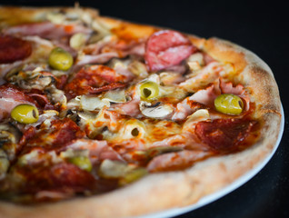 tasty italian pizza with fresh ingredients & vegetables