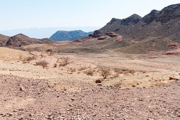 Desert mountains with an interesting geological formation on the front, Timna park, Israel