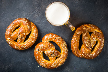 Oktoberfest food beer and bretzel on black.