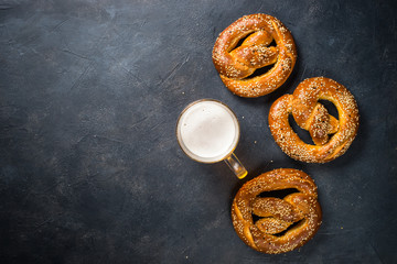 Oktoberfest food beer and bretzel on black.