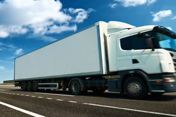 White truck and container is on highway - business, commercial, cargo transportation concept, clear and blank space on the side view