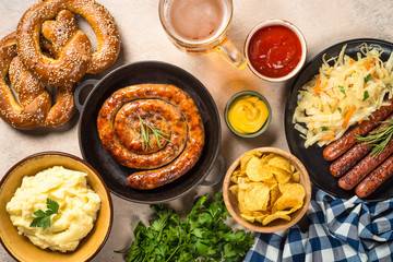 Oktoberfest food - sausage, beer and bretzel.