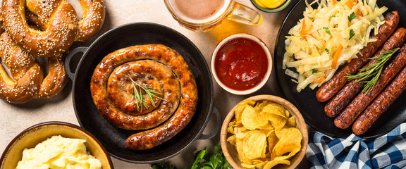 Oktoberfest food - sausage, beer and bretzel.