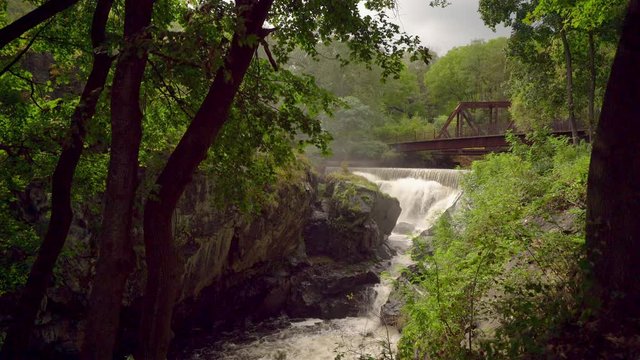 Waterfalls Under the Yantic Falls Historical Railroad Bridge Landmark in Connecticut, Wide-angle Establishing Shot