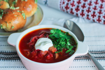 Traditional Ukrainian Russian soup, borsch with garlic donuts, pampushki on a white background