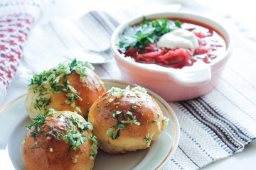 garlic bread with the soup, pampushki on a white background