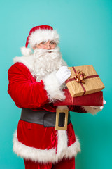 Santa Claus holding a gift box