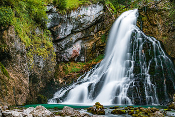 Obraz premium Beautiful alpine river view with silky water effect at the famous Golling Waterfall, Salzburg, Austria