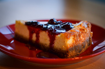 home made cheese cake with cherry jam