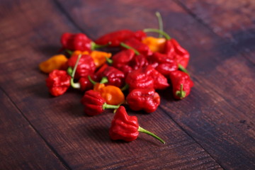 Bunch of red chili peppers on wooden table