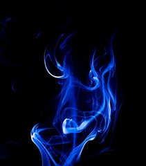 Blue smoke on black background