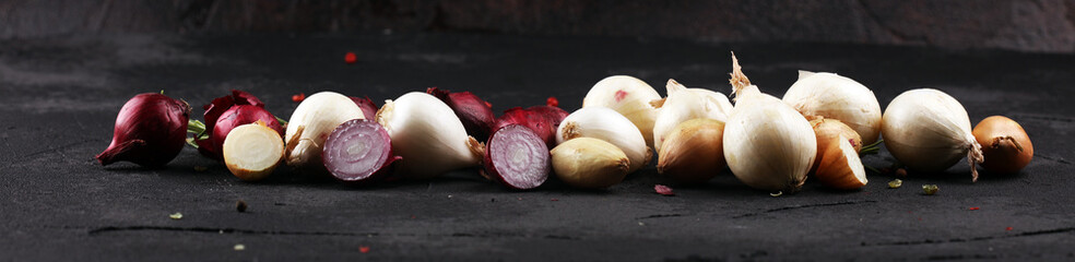 different onions on rustic table