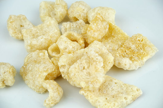 Crispy Pork rinds also known as chicharrones, snack and appetizer  