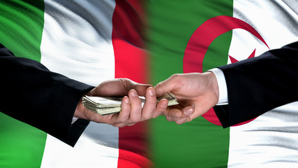 Italy and Algeria officials exchanging money, flag background, business deal