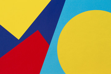 Texture background of fashion papers in memphis geometry style. Yellow, blue, light blue, red colors. Top view, flat lay