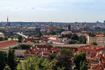 Fototapeta na wymiar View on Prague panorama with red roofs and historic architecture