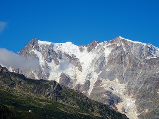 The "Monte Rosa", in the Italian Alps, with its glaciers, peaks and cliffs, near the pese of Macugnaga, Italy - August 2019.