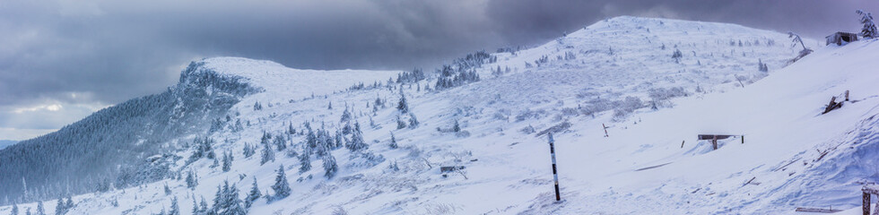 Mountain peak covered by heavy snow