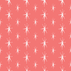 Mid Century star seamless pattern in coral pink and white. Retro styled mod look  that works well for Christmas,  winter decor, textiles, fashion and paper items. Vector.