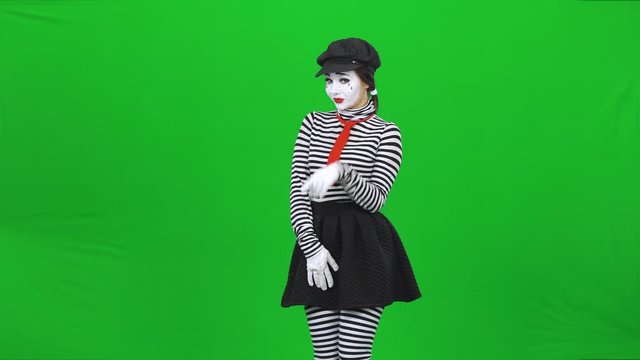 Mime young woman is smiling and seducing someone. Chroma key.
