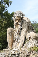 Fototapeta na wymiar The Appennine Colossus was sculpted by Giambologna in the 16th century, it is located in the renaissance park of Villa Demidoff near Florence in Tuscany, Italy.