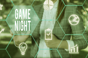 Conceptual hand writing showing Game Night. Concept meaning event in which folks get together for the purpose of getting laid Female human wear formal work suit presenting smart device